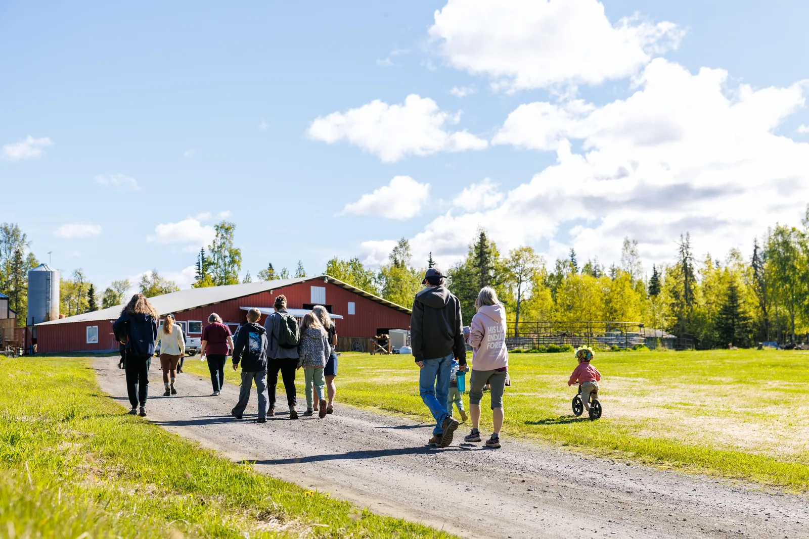 Guests hiking the forest trail down to the Kenai River